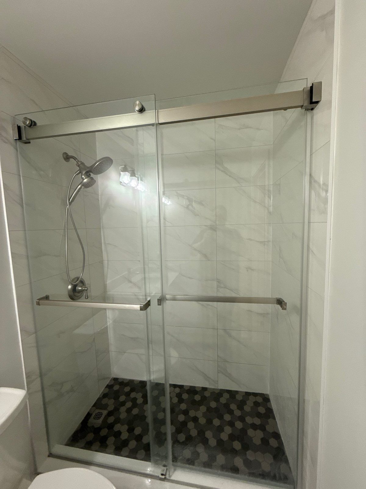 Walk-in shower with hex tile