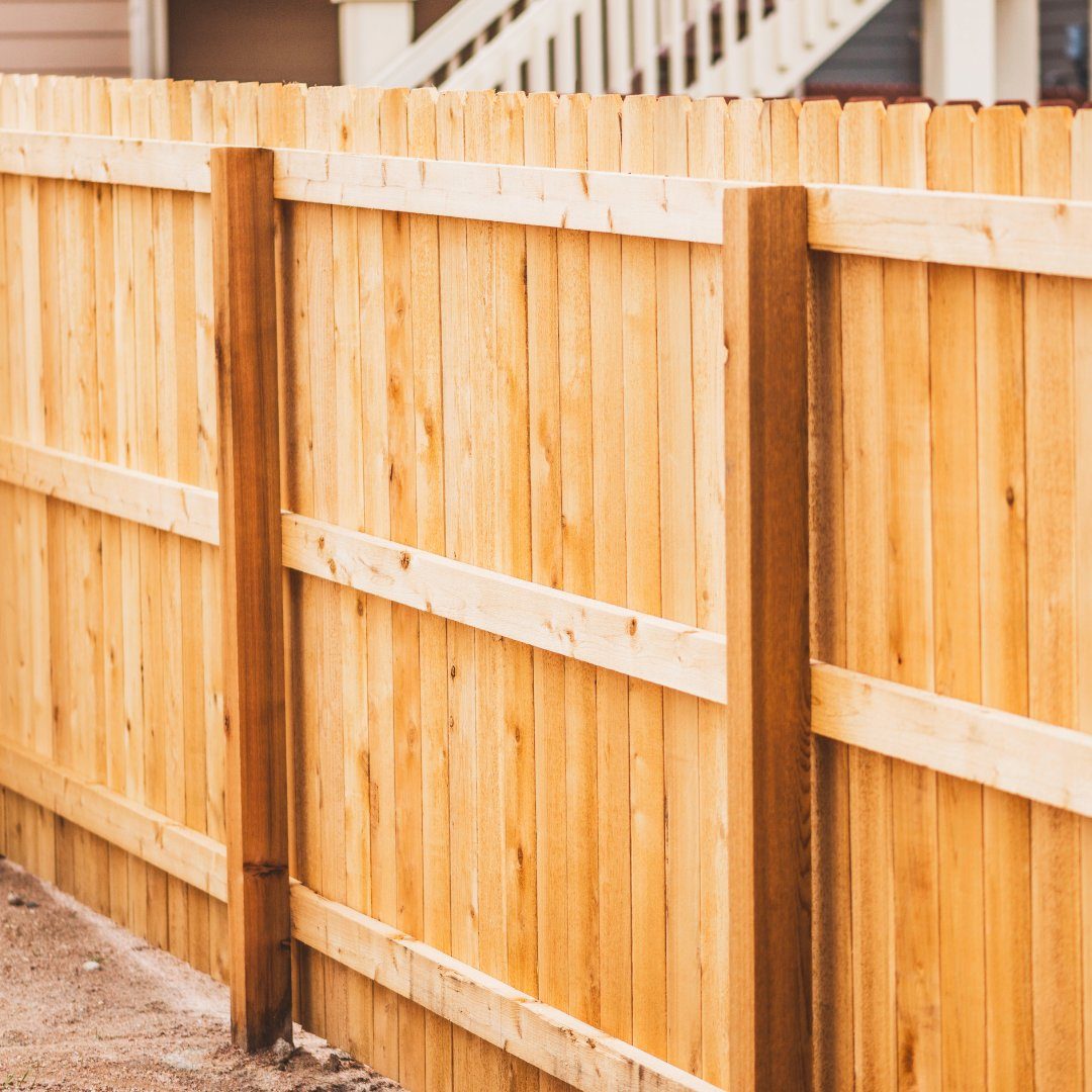 Vertical wood privacy fence with post caps
